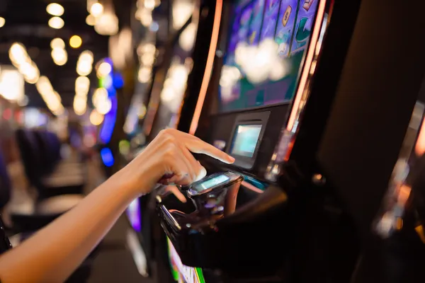 A young woman relaxing with her phone while dynamic casino elements float around her, illustrating the smooth mobile experience offered by the JILI7979 app.