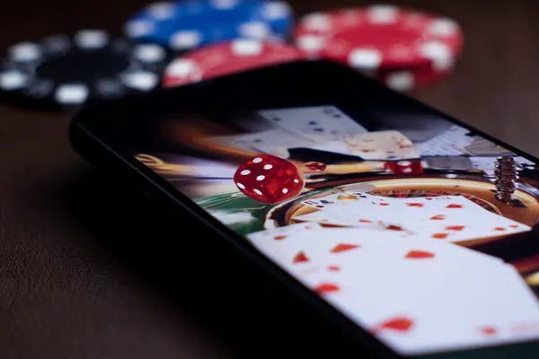 A glamorous woman holding casino chips in a neon-lit environment, representing the premium online casino atmosphere of JILI7979.