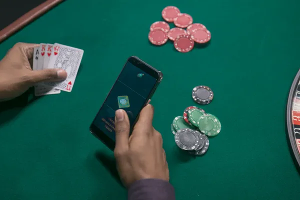A close-up shot of golden coins falling around a spinning roulette wheel, representing immersive casino action at JILI7979.