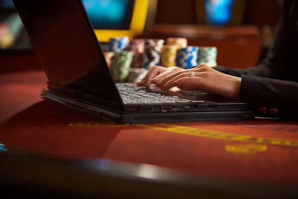 A glowing roulette wheel with cascading chips, symbolizing the engaging live and instant-win games available on JILI7979.